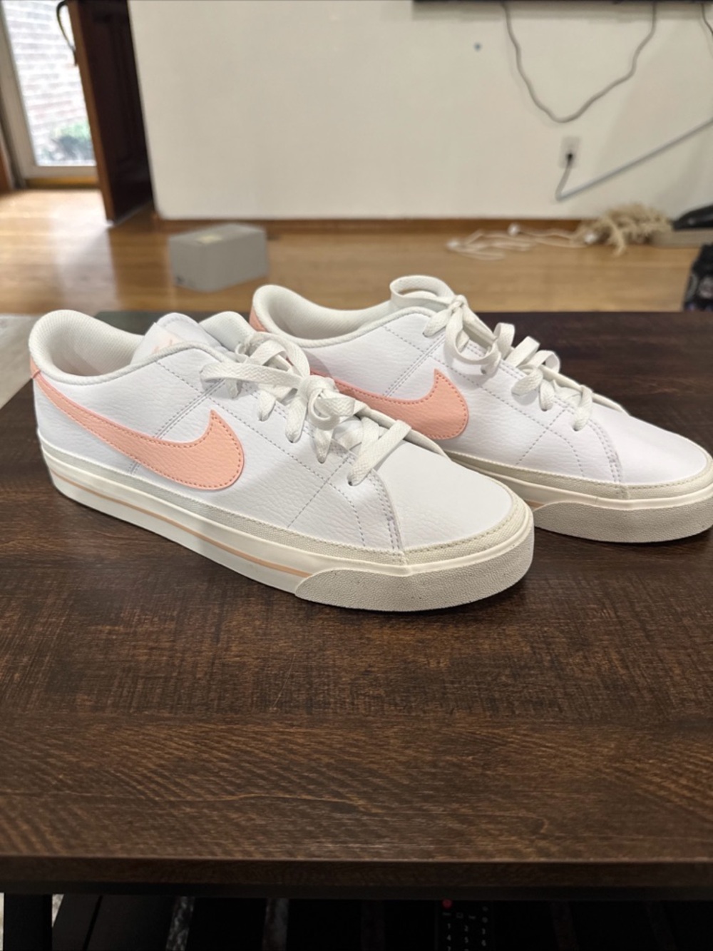 Nike White Low-Top Sneakers with Peach Swoosh